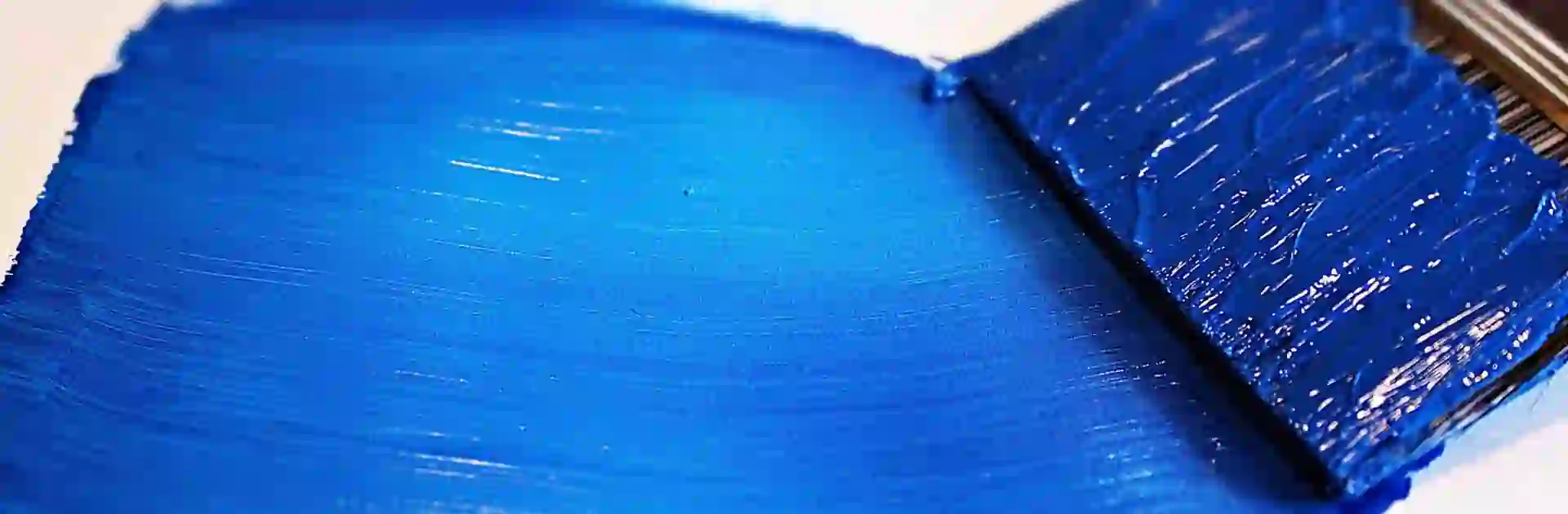 blue paint stroke and paint brush