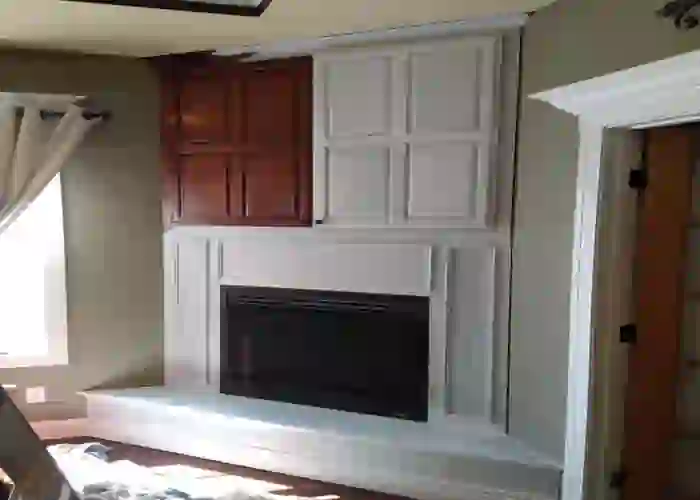 fireplace with surrounding cabinets painted white in Joplin, Mo