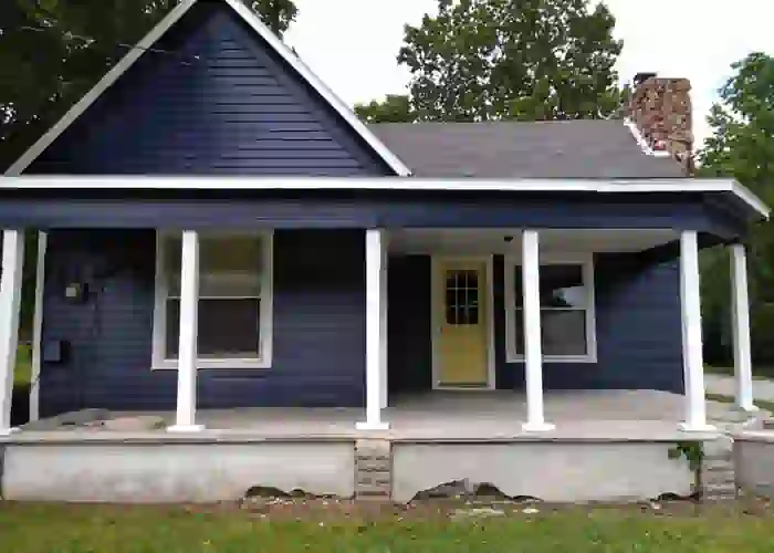 interior painting of blue house with yellow door in joplin, mo